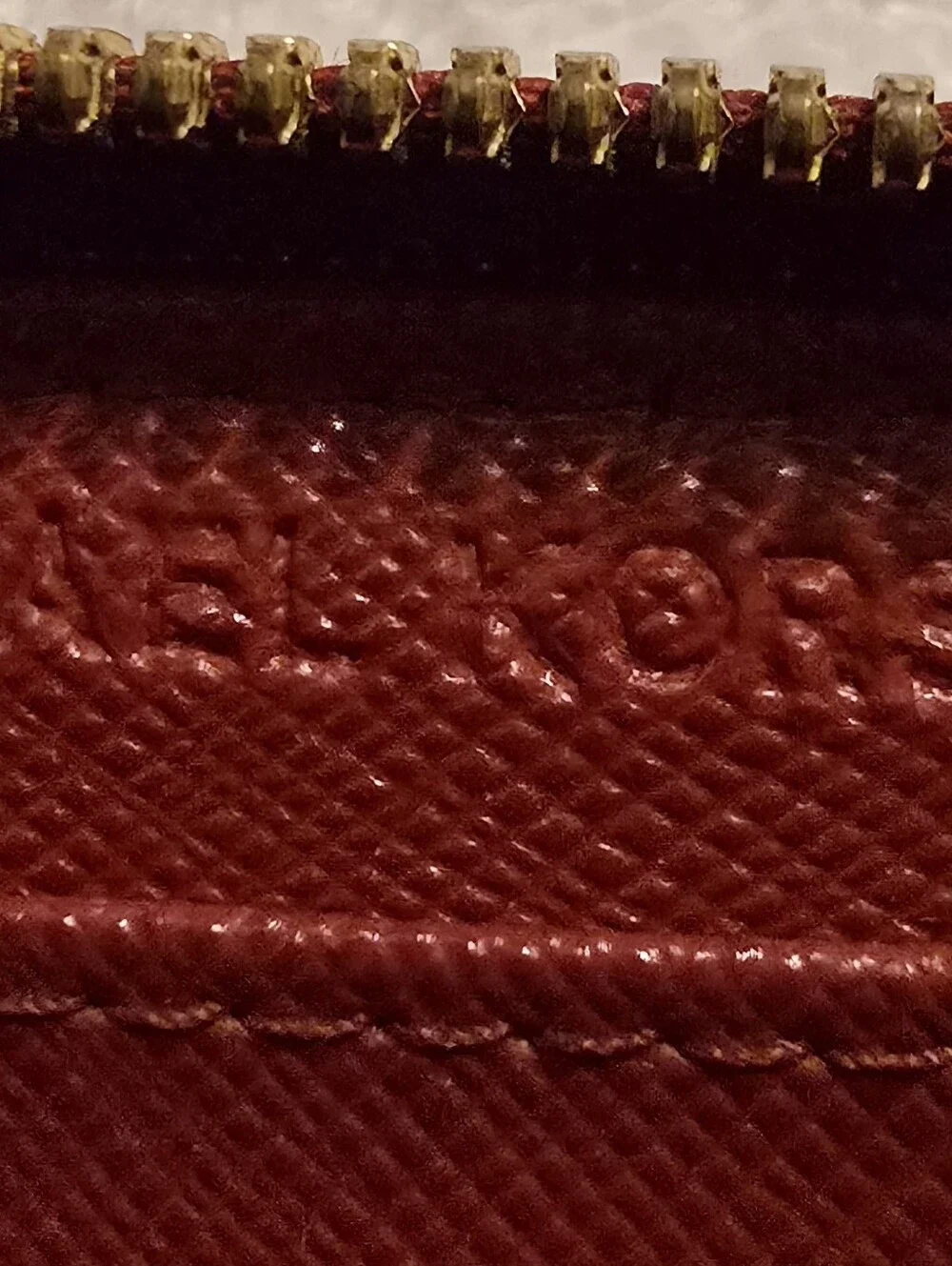 Michael Kors Red ostrich-patterned zip-around wallet featuring 1981 Goldtone